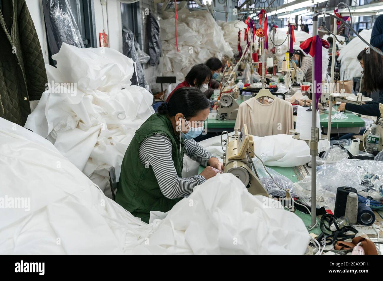 New York, United States. 10th Feb, 2021. LG Kathy Hochul visits Four Seasons Fashion as part of women-owned nonprofit Garment District for Gowns on 39th street of Manhattan in New York on February 10, 2021. LG was touring Four Season Fashion company owned by Tony Singh (not pictured). On this photo semastresses seen sewing PPE. (Photo by Lev Radin/Sipa USA) Credit: Sipa USA/Alamy Live News Stock Photo