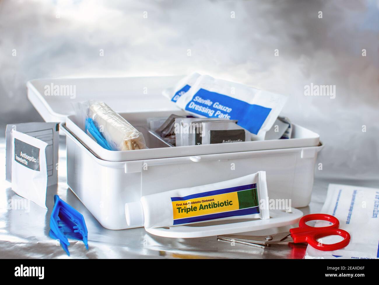 A plastic first aid kit holds many important items for house hold scrapes, scratches splinters and boo boos Stock Photo