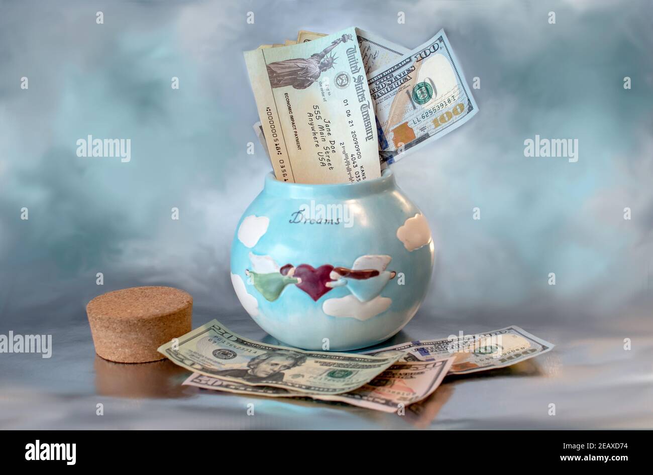 A dream jar, usually filled with extra cash for something one dreams of like a vacation or new car, is now needed for food and survival and the econom Stock Photo