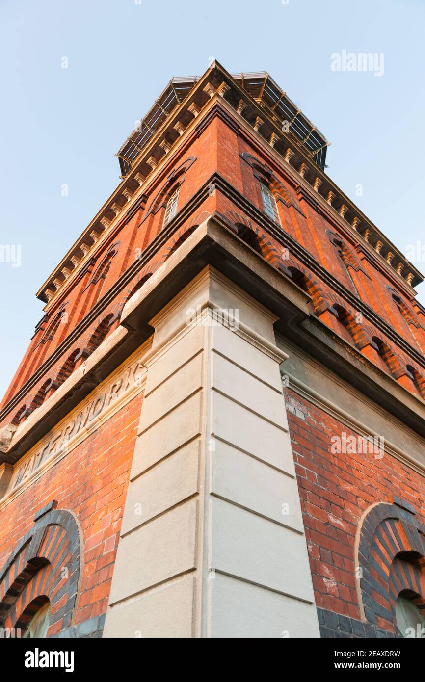 Corner of towering Invercargill Water Tower aesthetic utility red brick tower. building built in 1889. Stock Photo