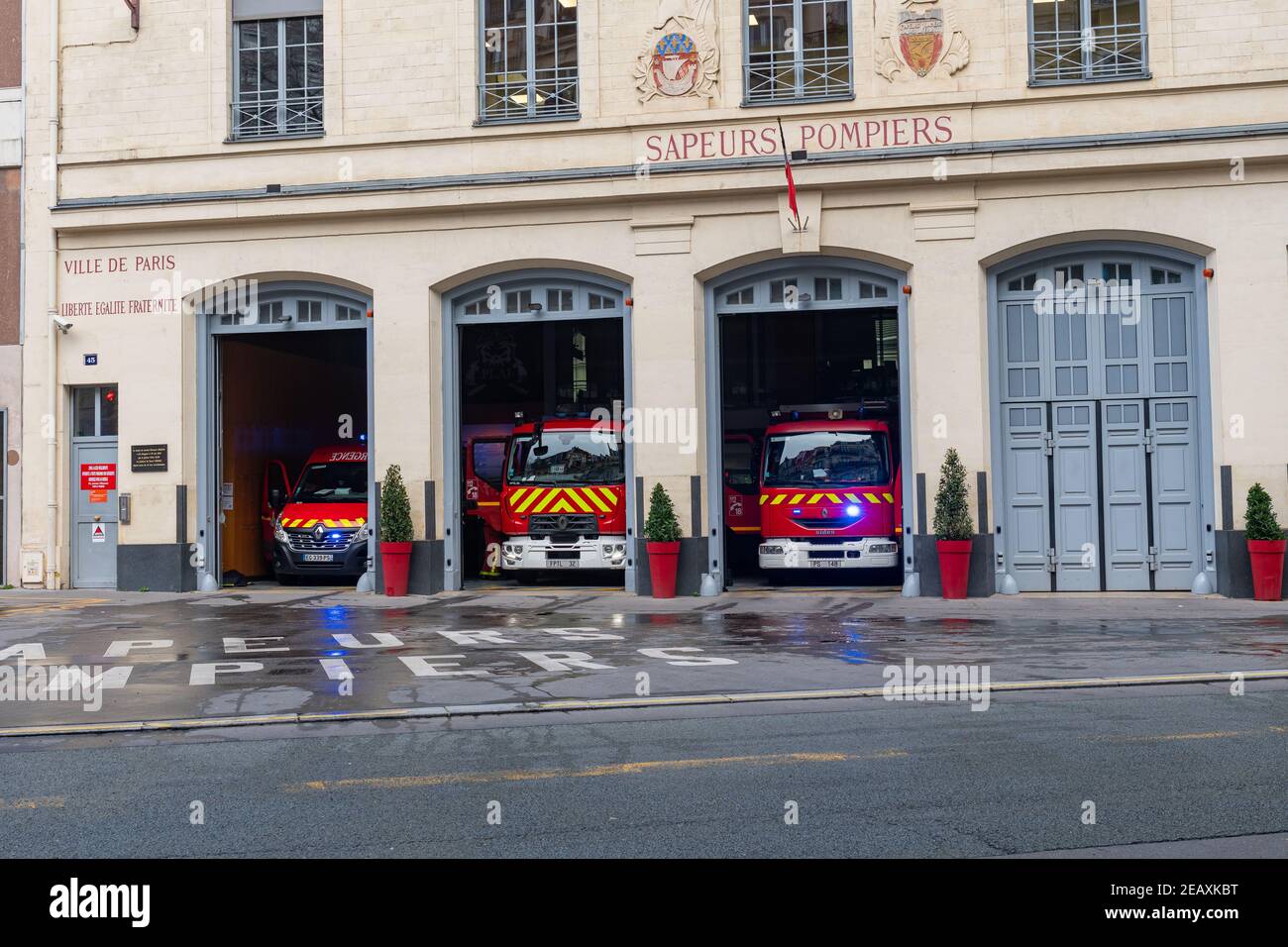 Red fire trucks of the Paris Fire Brigade - France Stock Photo