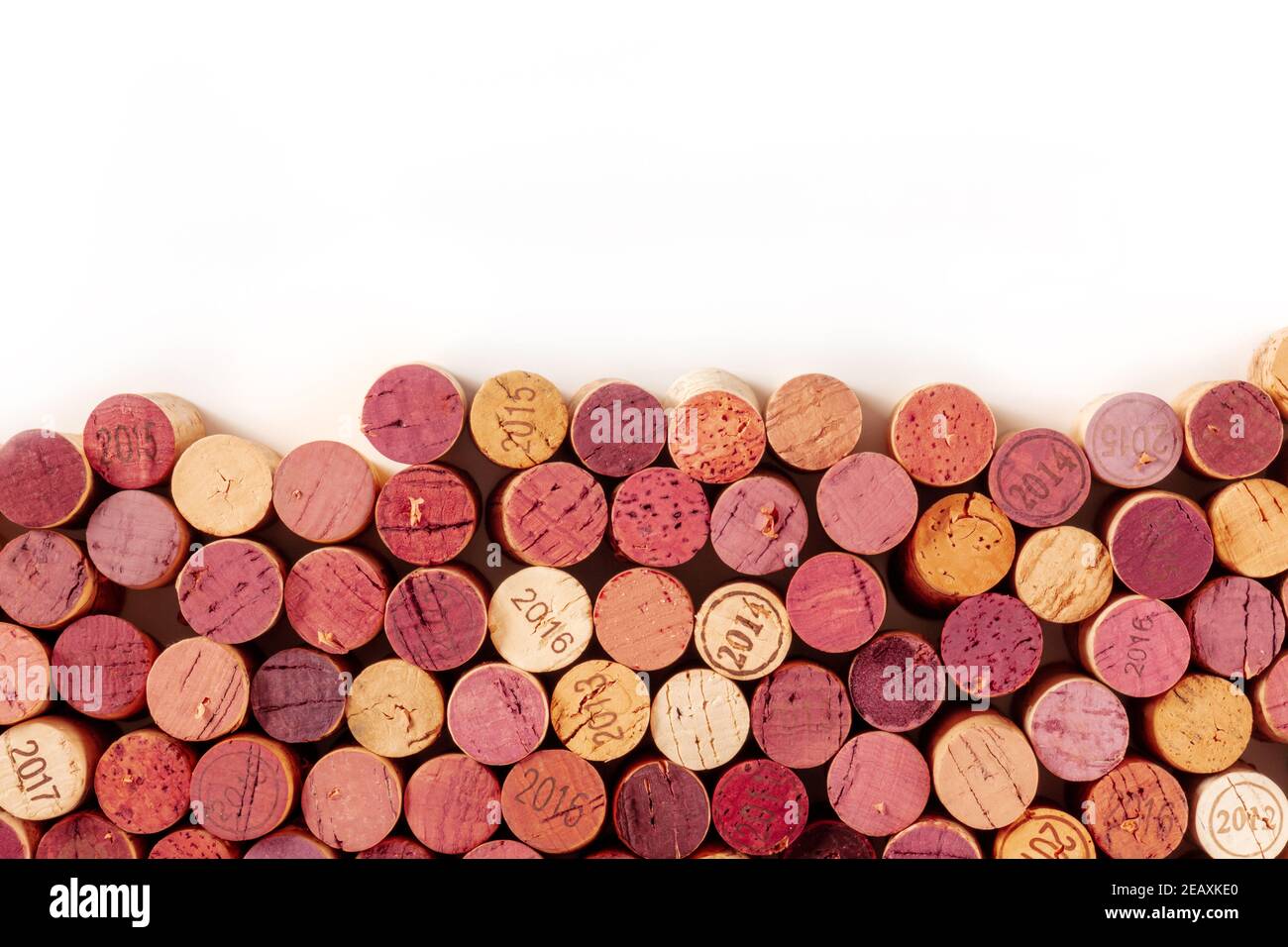 Wine corks background, a design template for a restaurant menu or winery brochure, shot from the top with a place for text, on a white background Stock Photo