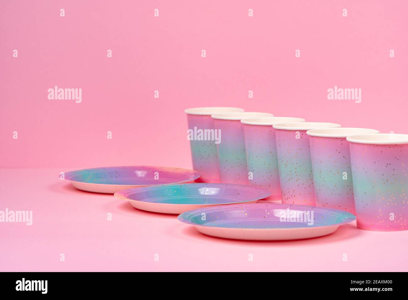 Pink party cups and plates on pink background Stock Photo Alamy