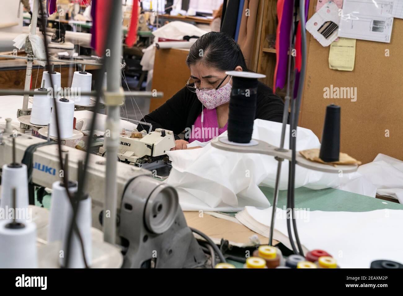 New York, United States. 10th Feb, 2021. LG Kathy Hochul visits Four Seasons Fashion as part of women-owned nonprofit Garment District for Gowns on 39th street of Manhattan. LG was touring Four Season Fashion company owned by Tony Singh (not pictured). On this photo semastress seen sewing PPE. Nonprofit organization helped already to manufacture more than 300,000 PPE and sent them to New York State hospitals. (Photo by Lev Radin/Pacific Press) Credit: Pacific Press Media Production Corp./Alamy Live News Stock Photo