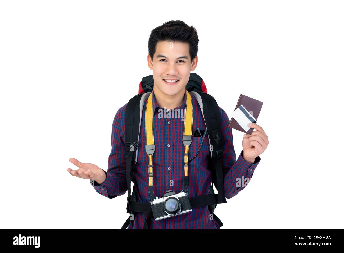 Young handsome Asian man holding passport and credit card enjoyed having holidays as the backpacker isolated on white studio background Stock Photo