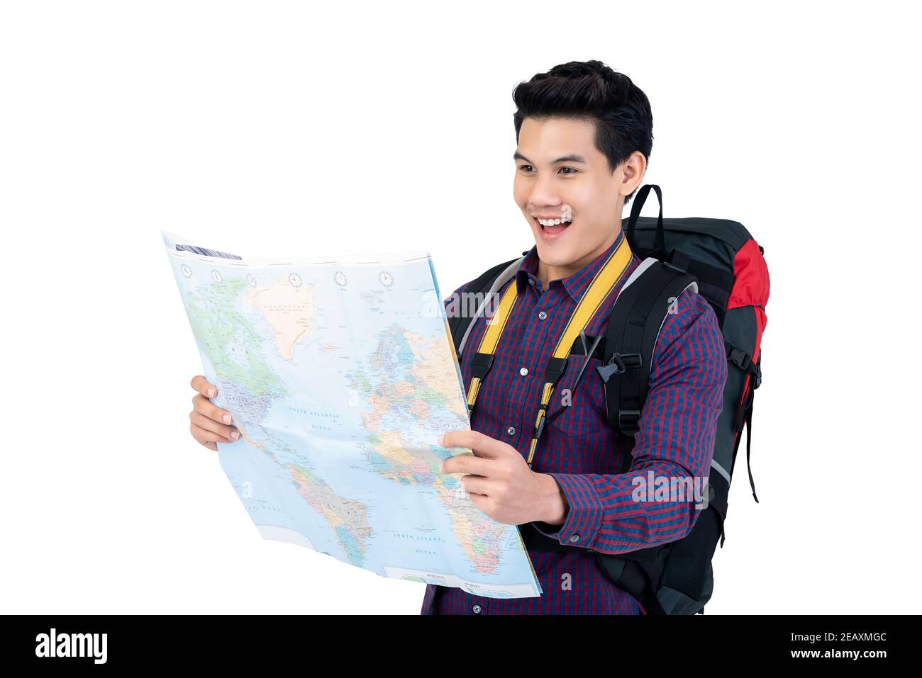Attractive smiling young Asian backpacker holding world map happily discovering his destination isolated on white studio background Stock Photo