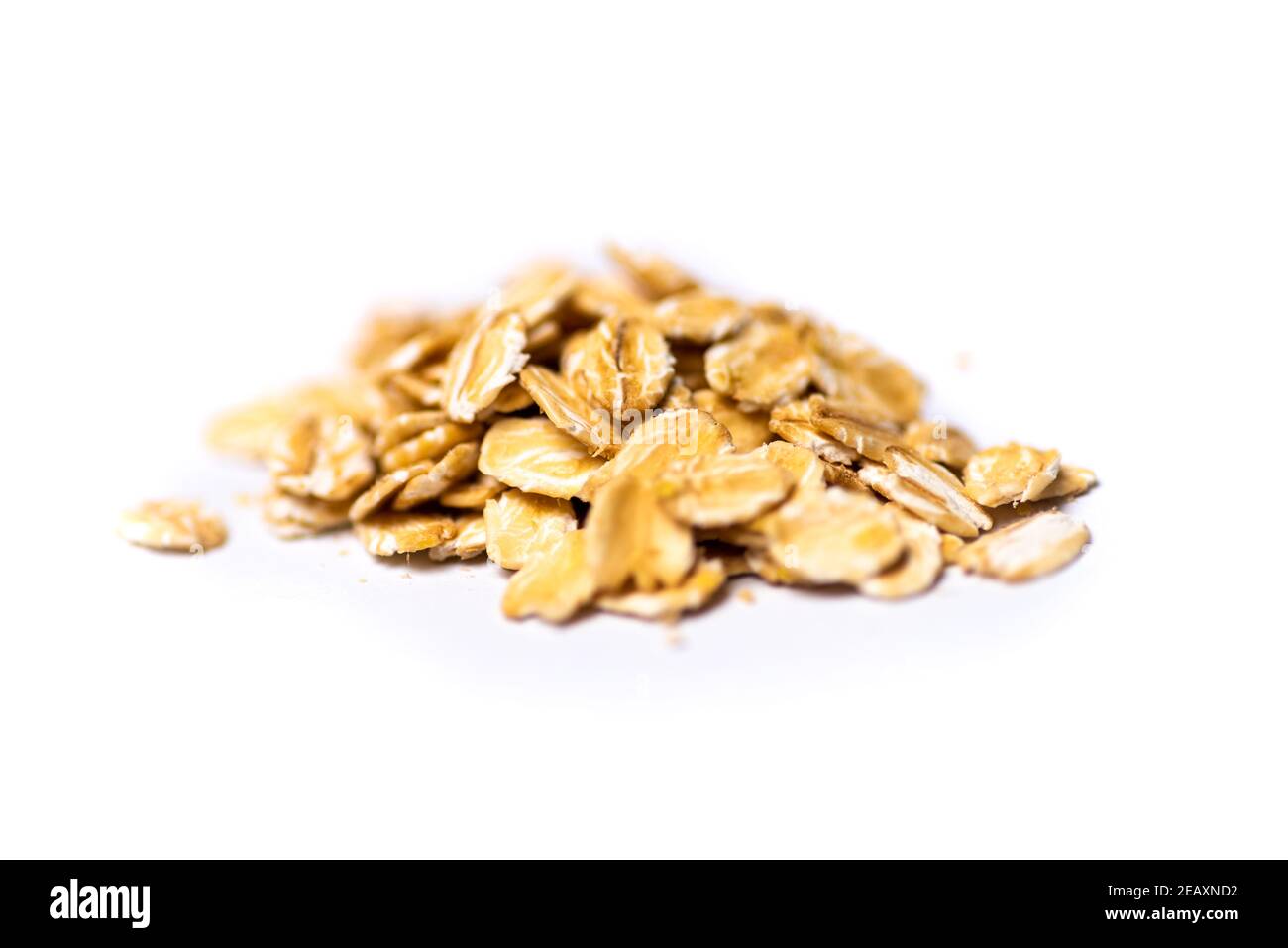 Uncooked oats breakfast cereals on a pile isolated Stock Photo