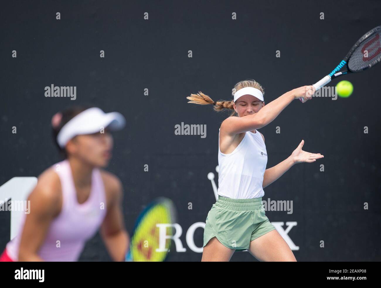 Melbourne, Melbourne, Australia. 11th Feb, 2021. Maddison Inglis (R)/Lizette Cabrera compete during the women's doubles first round match between Wang Yafan of China/Renata Voracova of the Czech Republic and Maddison Inglis/Lizette Cabrera of Australia at the Australian Open 2021 tennis tournament in Melbourne Park, Melbourne, Australia on Feb. 11, 2021. Credit: Hu Jingchen/Xinhua/Alamy Live News Stock Photo
