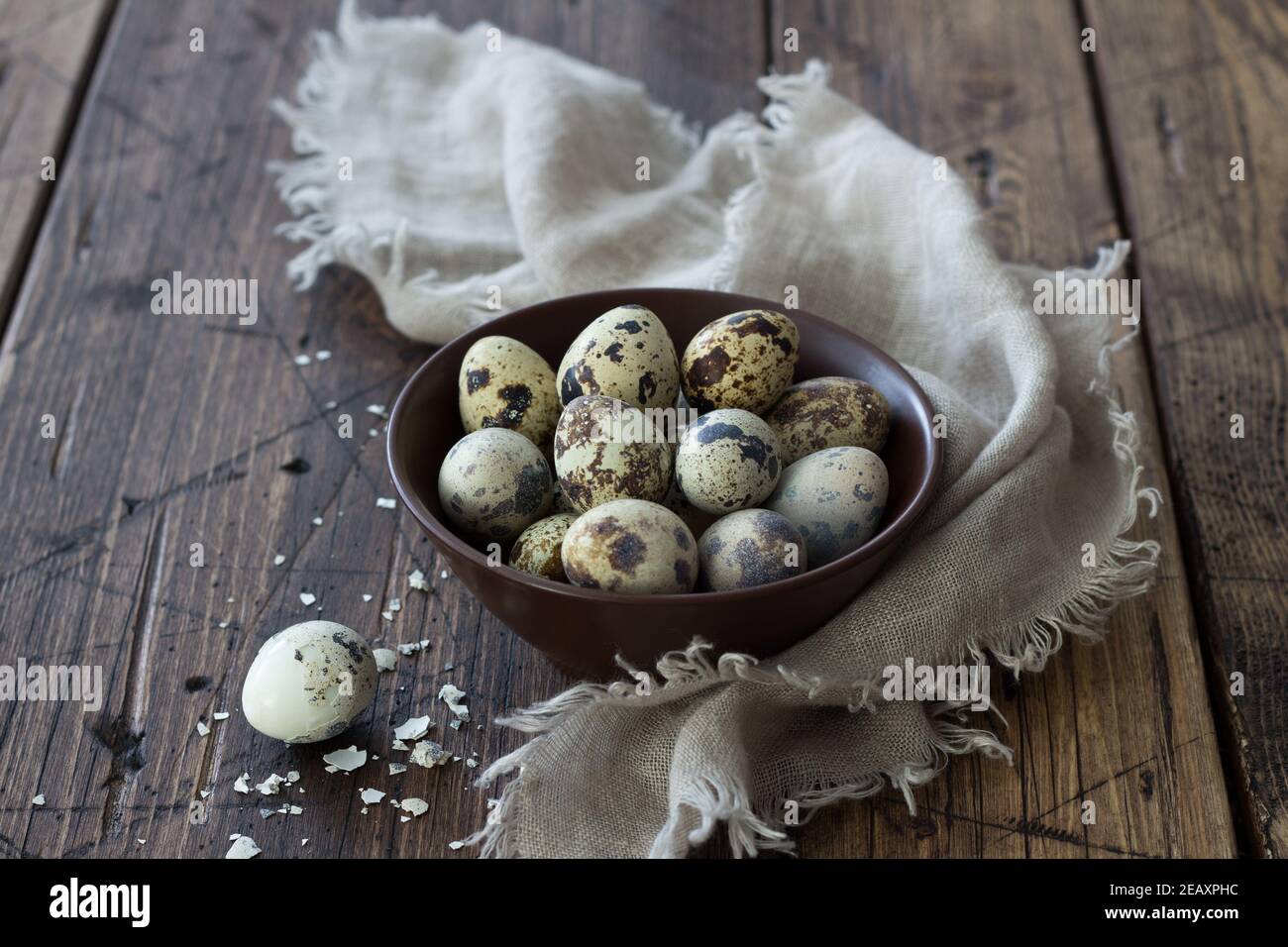 Boiled quail eggs on a wooden table, selective focus, rustic style, horizontal Stock Photo