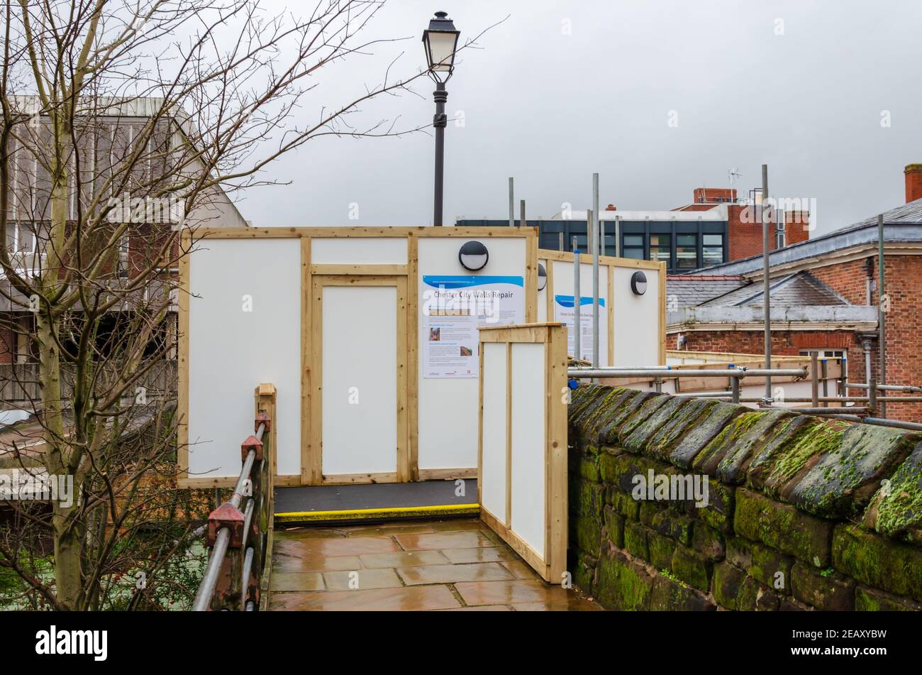 Chester; UK: Jan 29, 2021: Temporary hoardings have been erected on parts of the historic Chester City Walls whilst refurbishment work is carried out. Stock Photo