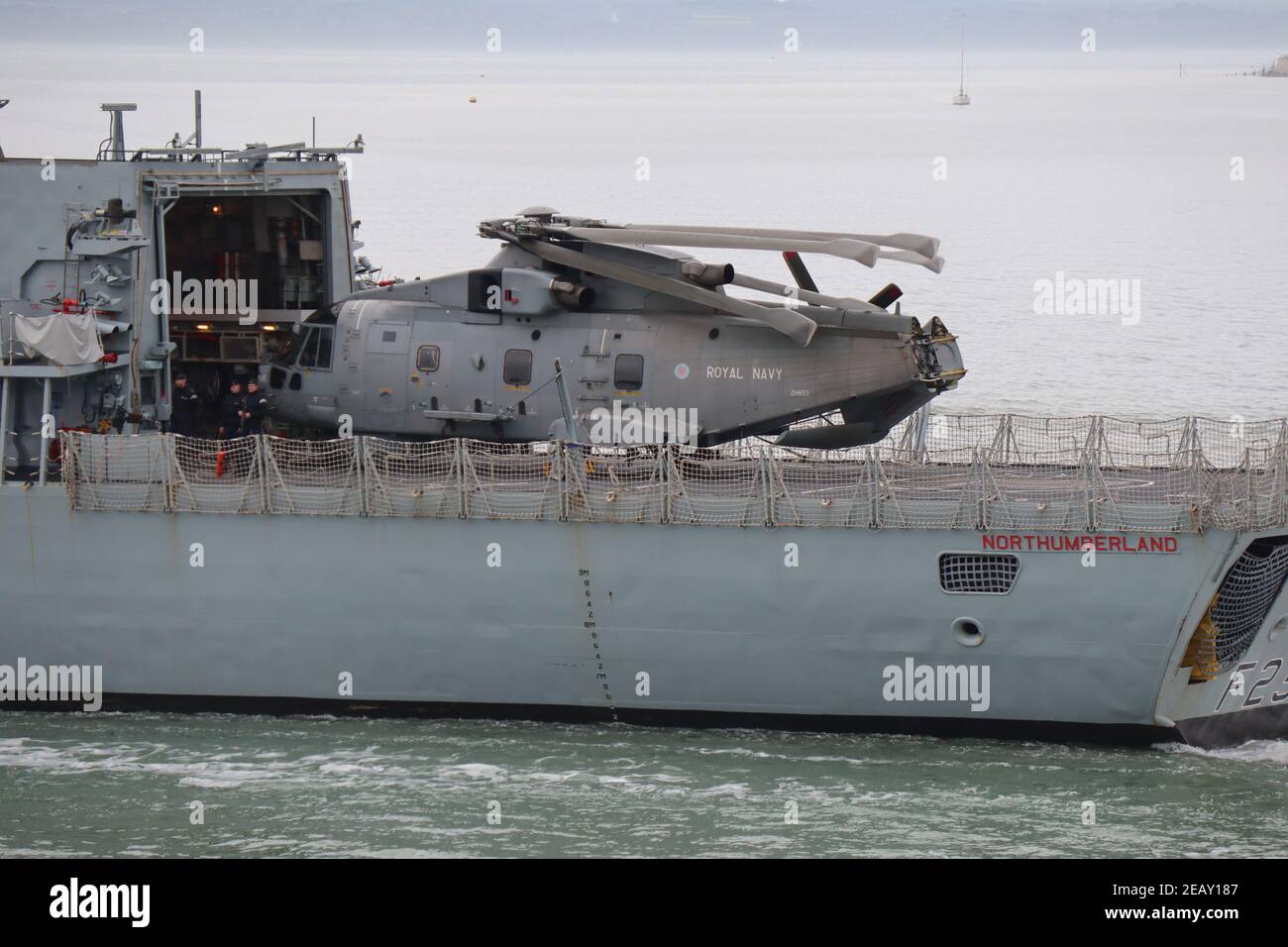 an-agustawestland-merlin-hm2-helicopter-on-the-flight-deck-of-the-plymouth-based-royal-navy-type-23-frigate-hms-northumberland-as-it-leaves-harbour-2EAY187.jpg