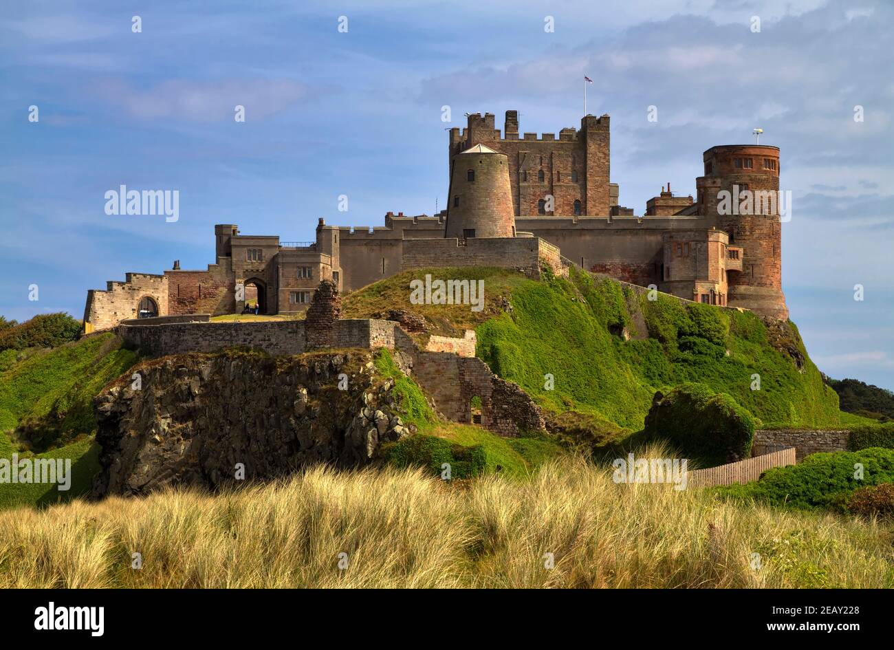 Bamburgh Castle, Northumberland. Built on an outcrop of volcanic dolerite, the castle is one of the largest inhabited castles in England. Stock Photo