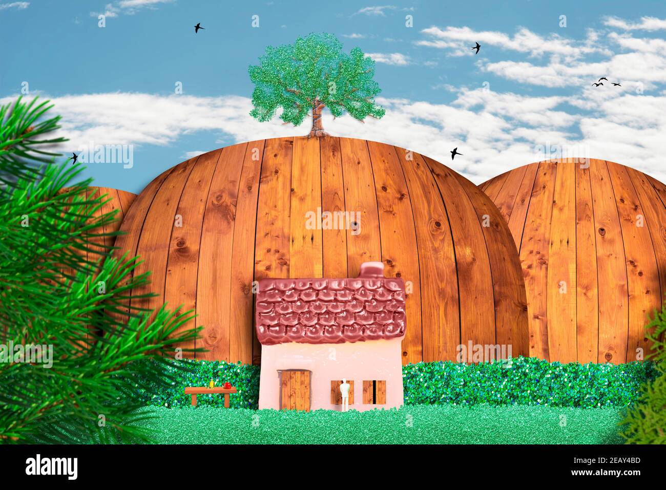 Man in a idyllic landscape with lonely house in nature, quiet life, rest concept. Surreal, abstract image. Stock Photo