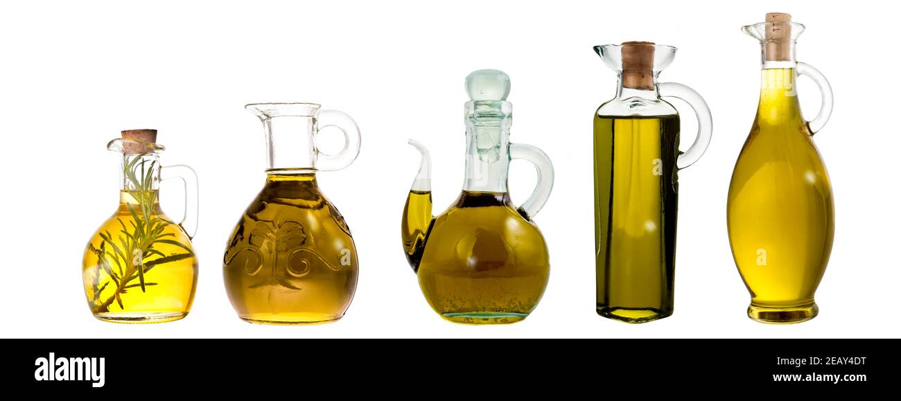 Extra virgin olive oil bottle and jars isolated. Group of bottle and jars with extra selection olive oil varieties isolated on white background Stock Photo