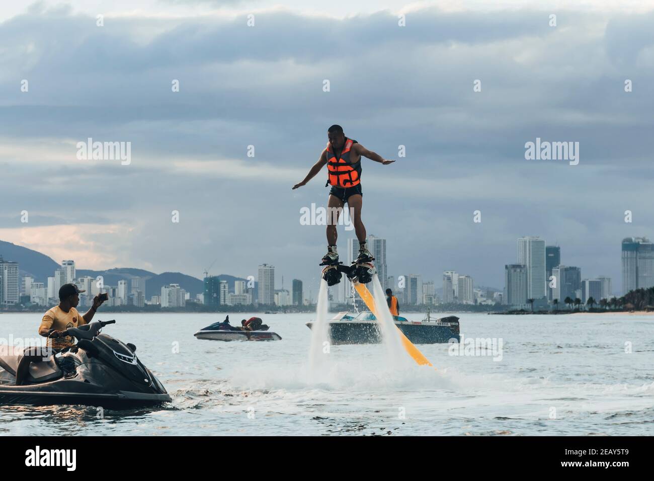VINPEARL RESORT, NHA TRANG, VIETNAM - 05.01.2019: The new spectacular  sport, the flyboard is showed in the coast of beach on the sunset. Man on  flyboa Stock Photo - Alamy