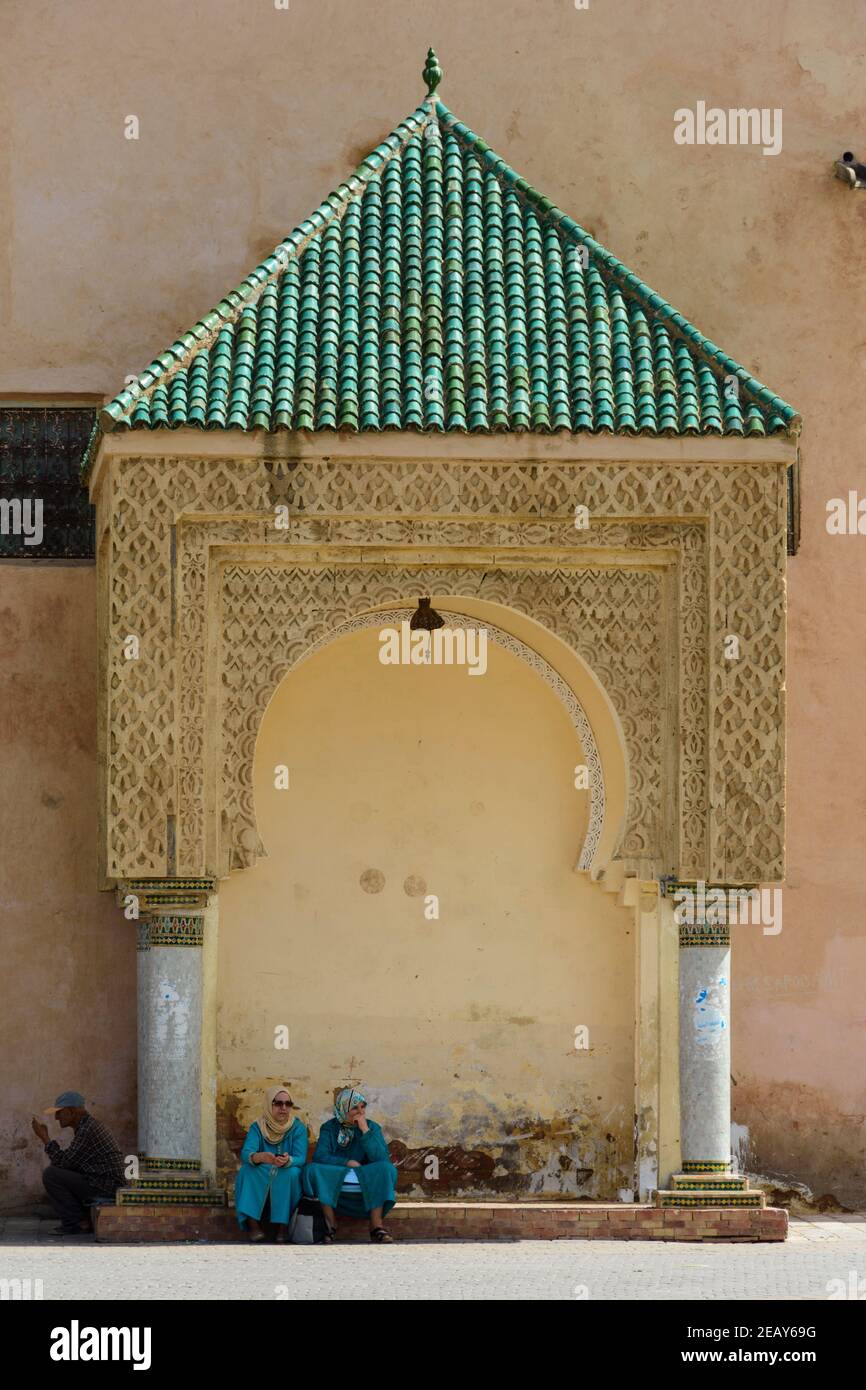 El Hedim square of Meknes in Morocco. Two women sitting in a sentry box. Stock Photo
