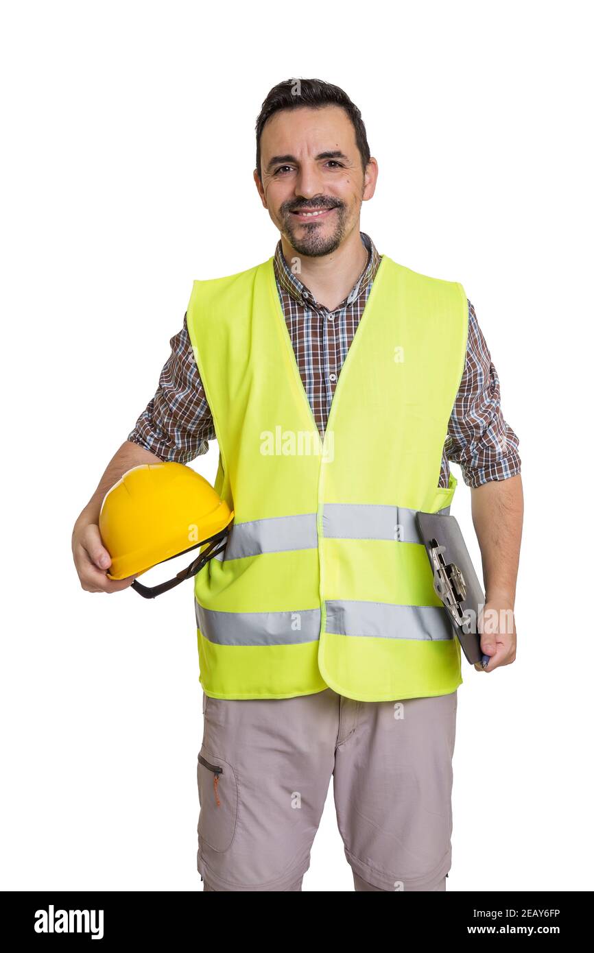 Content male constructor with yellow hardhat and clipboard standing on white background and looking at camera Stock Photo