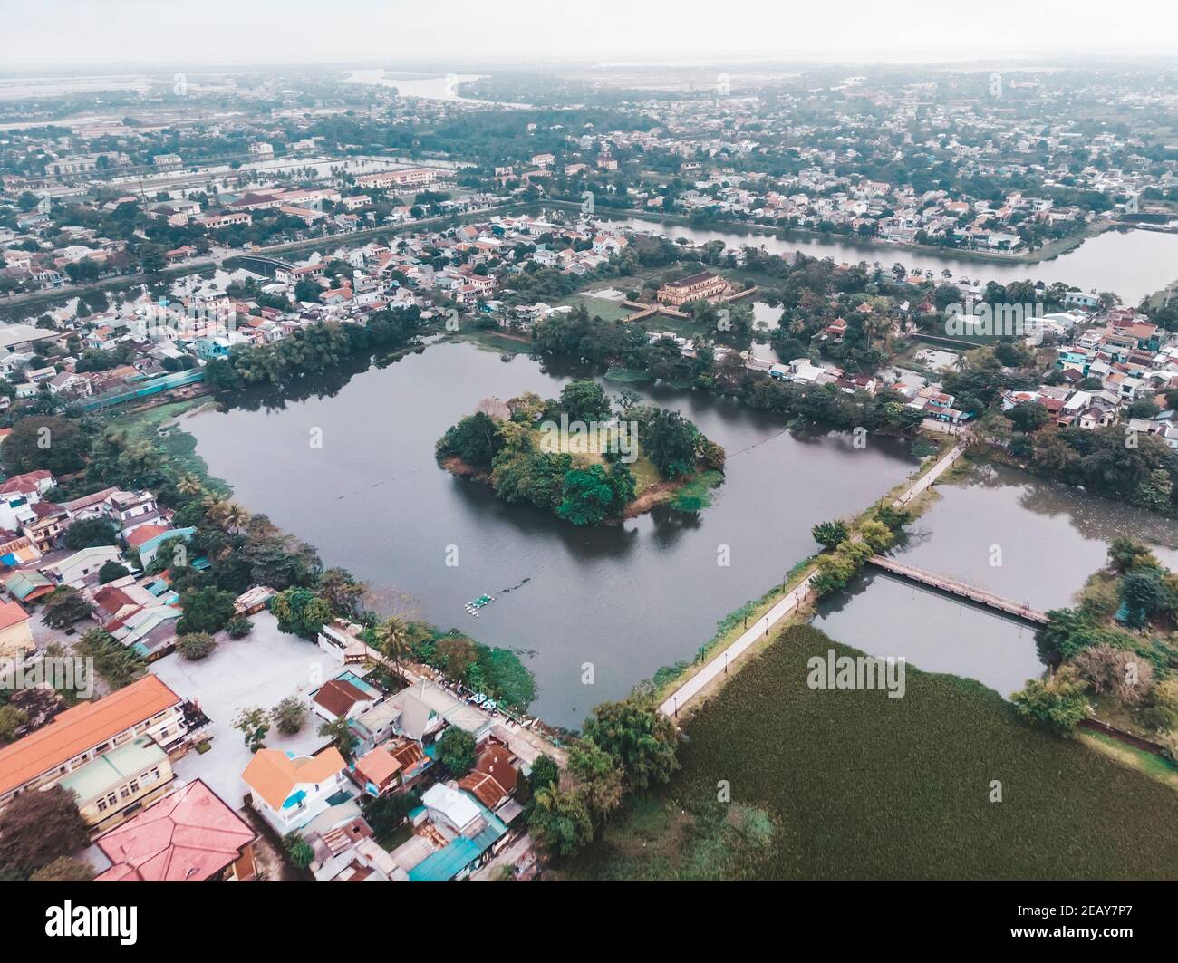 The city of hue in the mist of Vietnam. The view from the top. Aerial view. Rainy season, winter. square lake in the city centre of hue Stock Photo