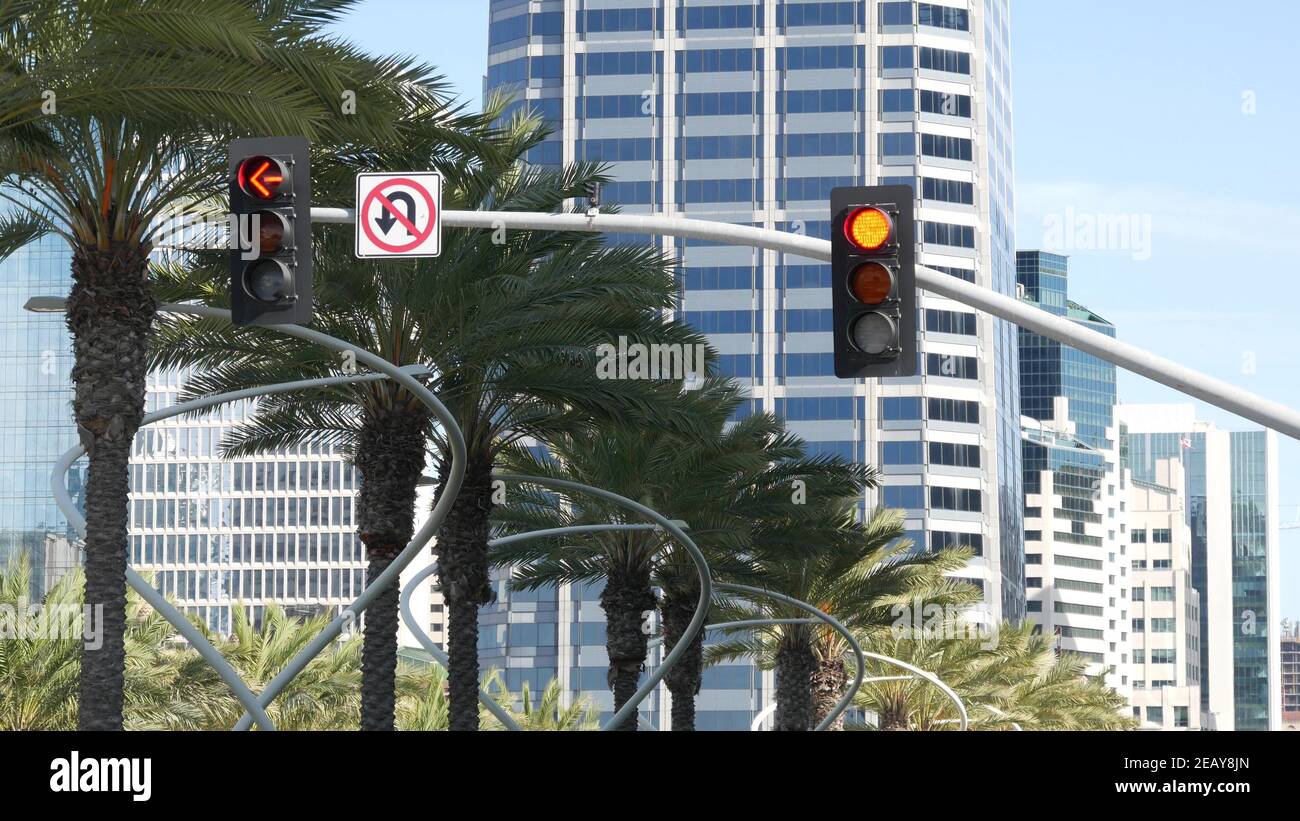 Traffic light and caution sign, road intersection in USA