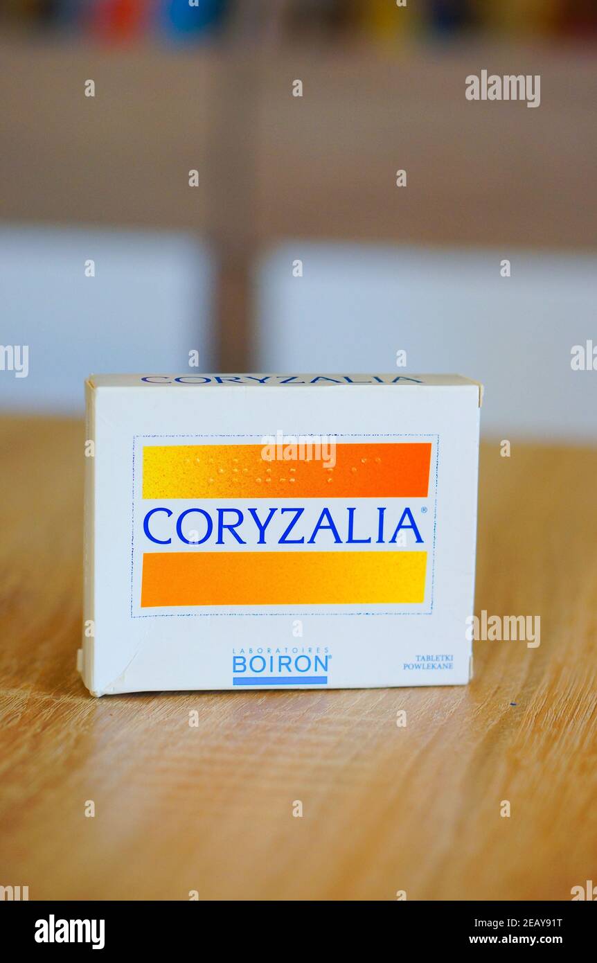 POZNAN, POLAND - Mar 02, 2016: Coryzalia medicine in a box standing on wooden table Stock Photo