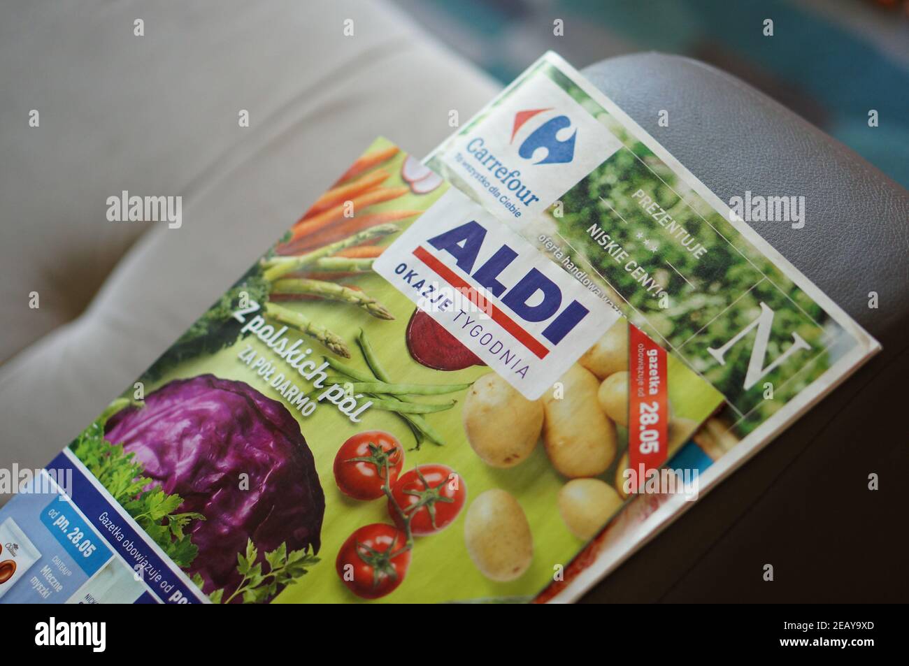 POZNAN, POLAND - May 28, 2018: Carrefour and Aldi supermarket brochures  laying on a sofa Stock Photo - Alamy