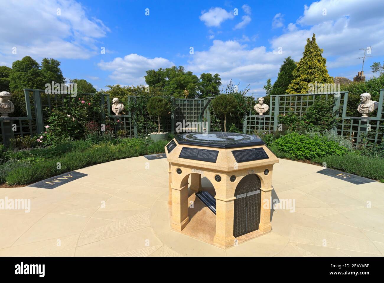 Burghley House Garden of Surprises. Busts of Caesars slowly revolve above flowerbeds that surround a complex longitude dial. Stock Photo