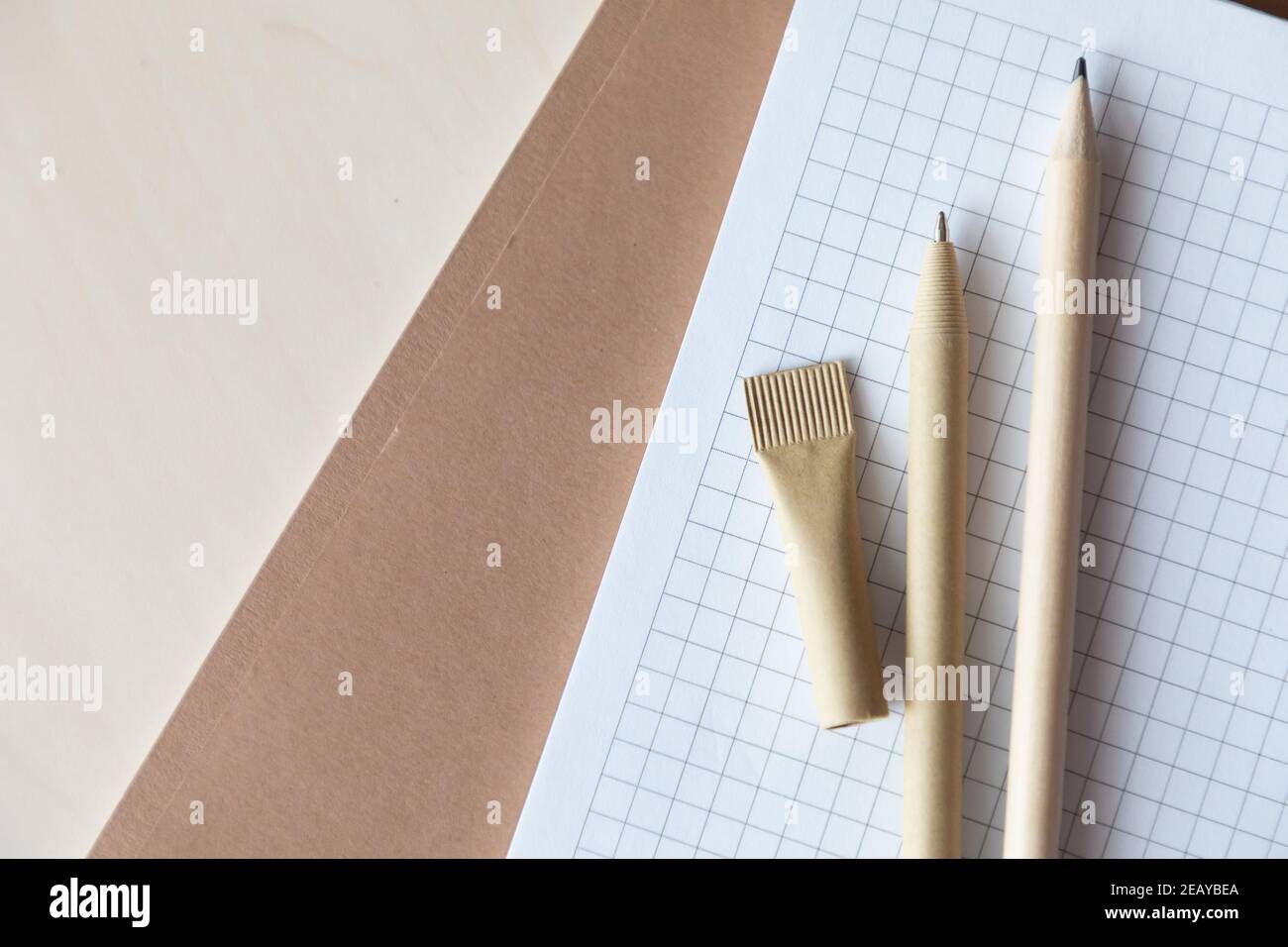 Reusable eco-friendly craft paper pen and pencil on notebook. Writing ...
