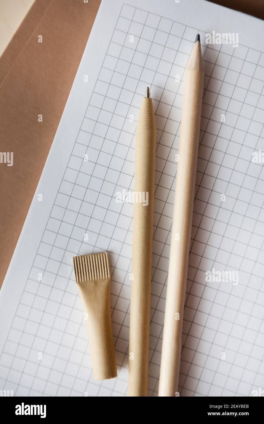 Reusable ecofriendly craft paper pen and pencil on notebook. Writing
