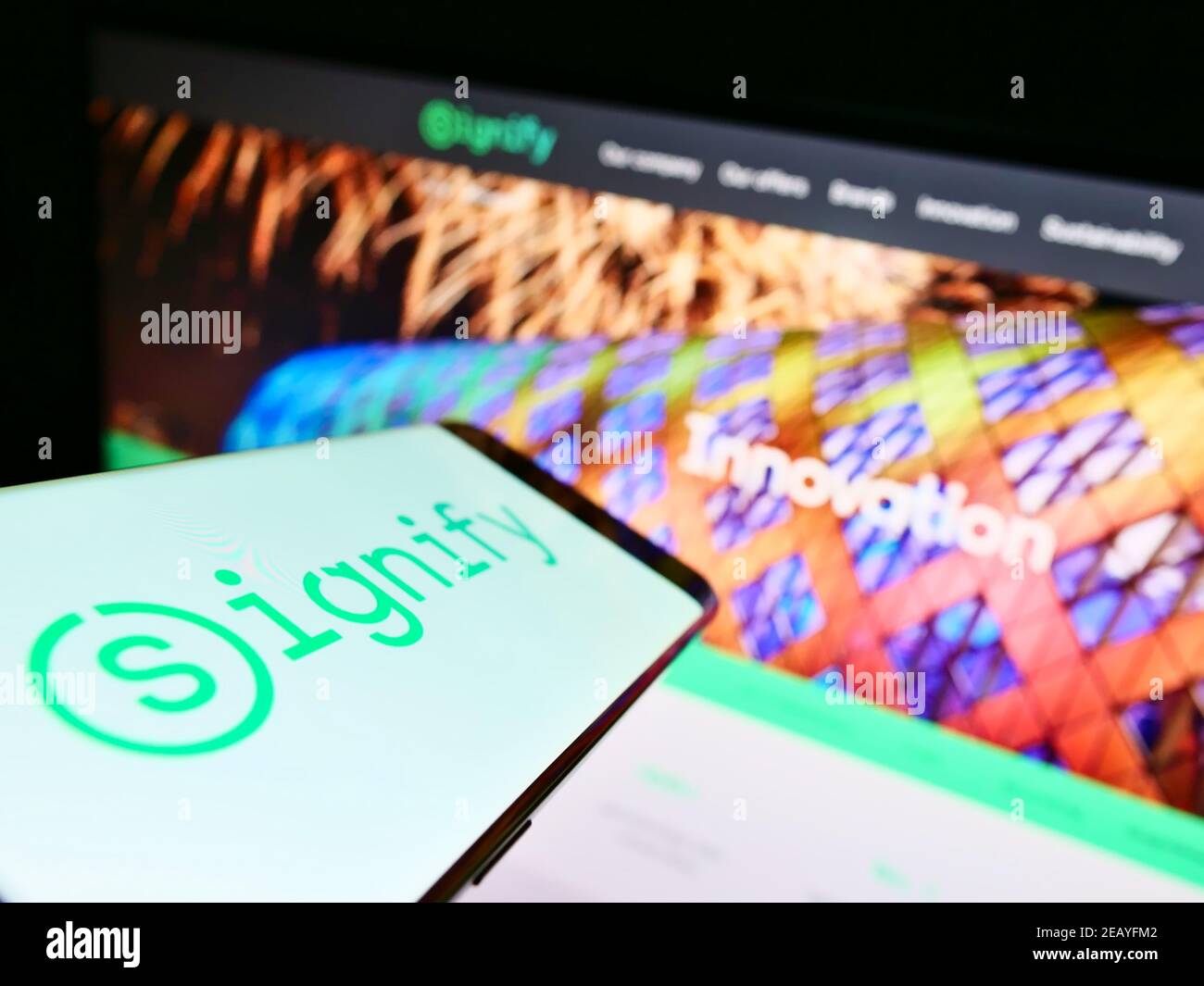 Mobile phone with business logo of Dutch lighting equipment company