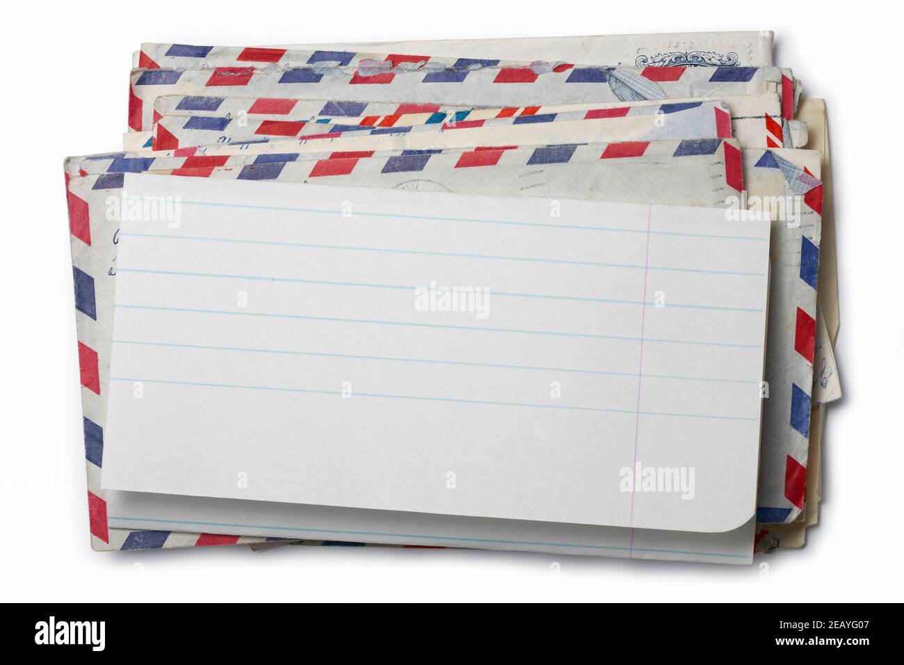 Picture of a pile of envelopes with a blank paper on the top. Stock Photo