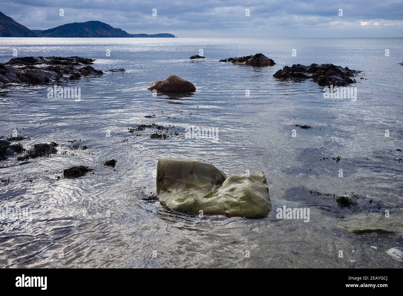 Single larger stone looking out over the Irish Sea at Whitestrand beach, Niarbyl on the west coast of the Isle of Man Stock Photo