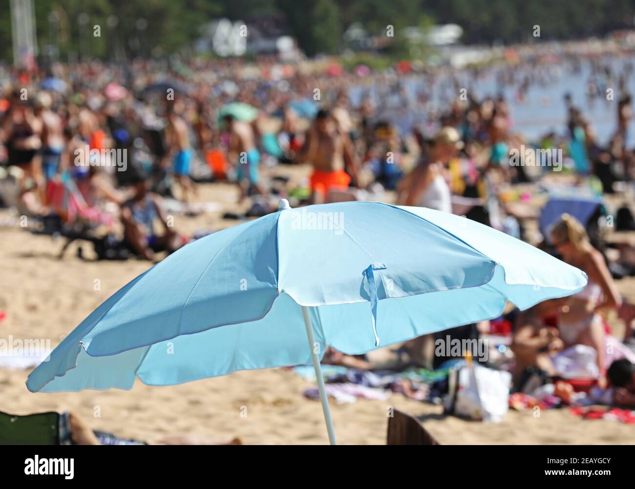 MOTALA, SWEDEN- 25 JULY 2018: Parasol on the beach in Varamon on a hot summer day. Stock Photo