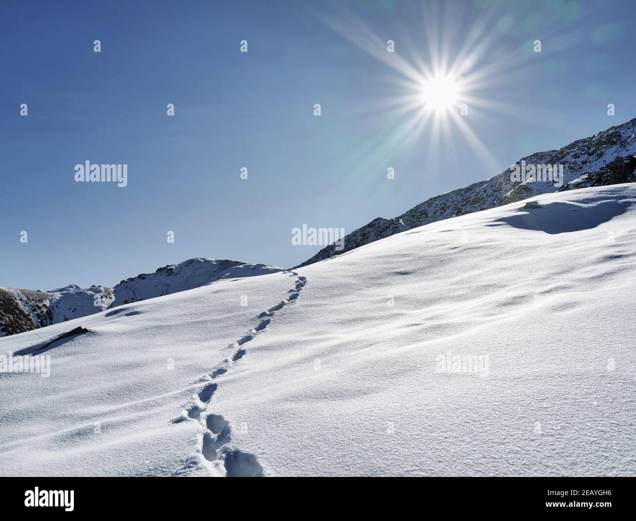 Beautiful Minimalism landscape at high mountains with snow against blue sky at winter time in Kazakhstan Stock Photo