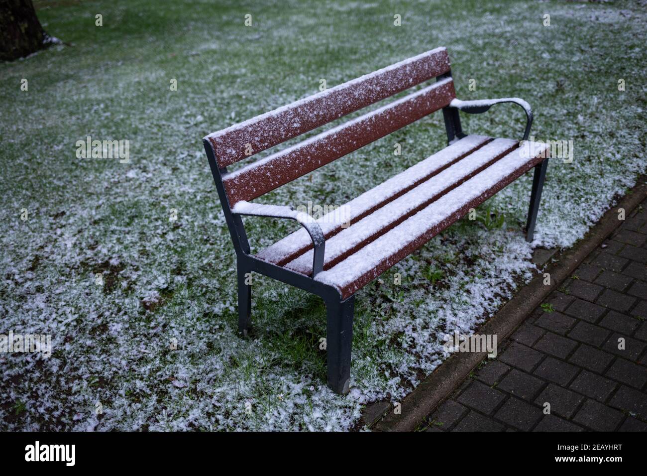 Realistic bench with snow, cold weather, frozen green grass Stock Photo ...