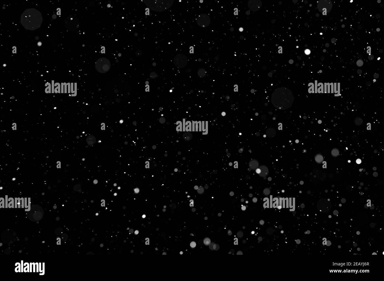 Bokeh of white snow on a black background. Snowfall - new design ...