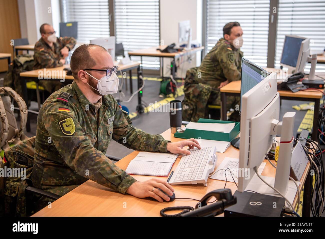 Oldenburg, Germany. 11th Feb, 2021. Soldiers of the Bundeswehr work in the situation centre. The 1st Armoured Division in Oldenburg is organising assistance in the Corona pandemic in five federal states as the Regional Command Staff West: North Rhine-Westphalia, Hesse, Lower Saxony, Bremen and Saxony-Anhalt. Credit: Sina Schuldt/dpa/Alamy Live News Stock Photo