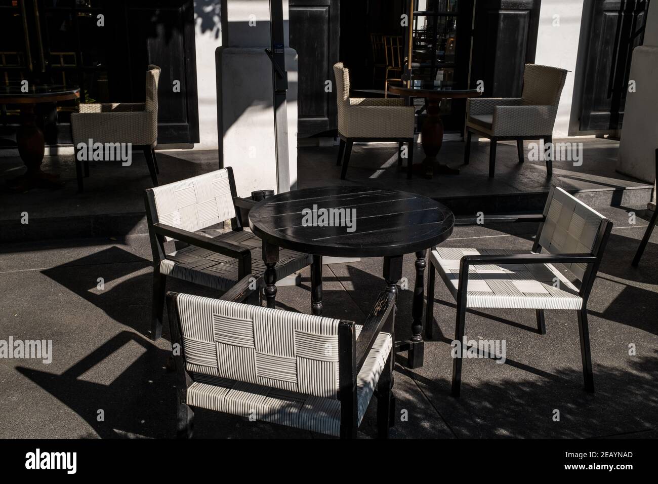 Chairs and tables in the garden Stock Photo - Alamy