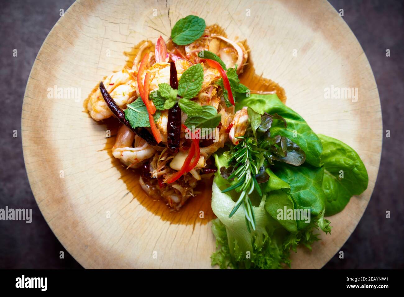 Spicy Thai style prawn salad at a street food market in Bangkok
