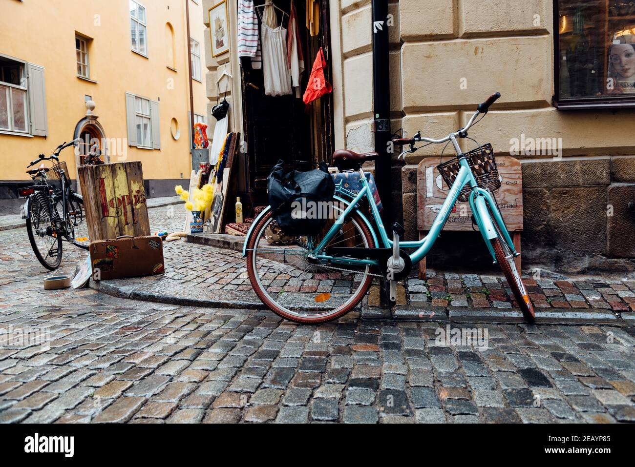 Stockholm, Sweden - August 8, 2019: Bicycles parked in front of vintage fashion store in Gamla Stan quarter Stock Photo