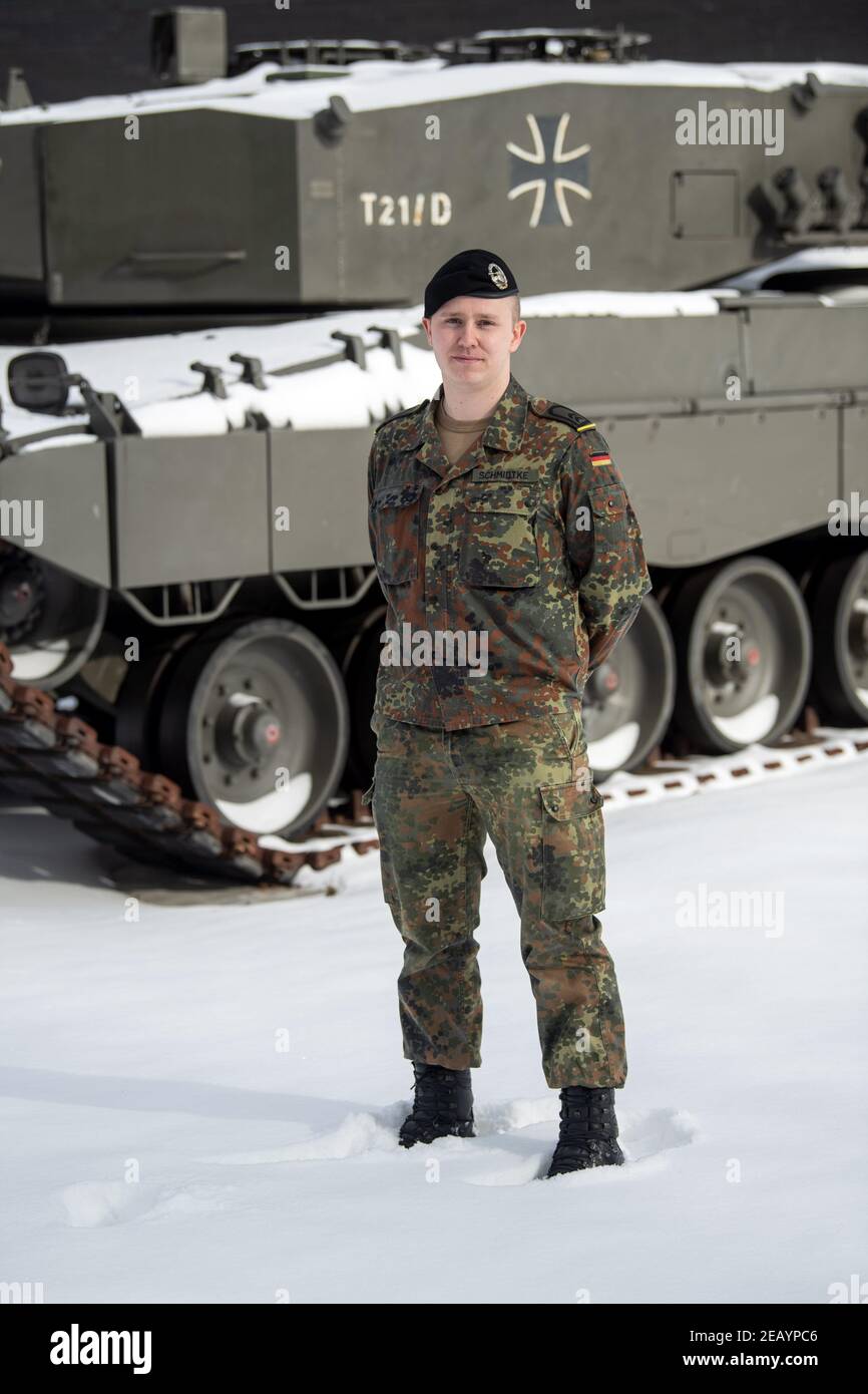 Oldenburg, Germany. 11th Feb, 2021. Tammo Schmidtke, first sergeant, stands in front of a Bundeswehr emergency vehicle. The 1st Armoured Division in Oldenburg is organising assistance in the Corona pandemic in five federal states as the Regional Command Staff West: North Rhine-Westphalia, Hesse, Lower Saxony, Bremen and Saxony-Anhalt. Credit: Sina Schuldt/dpa/Alamy Live News Stock Photo