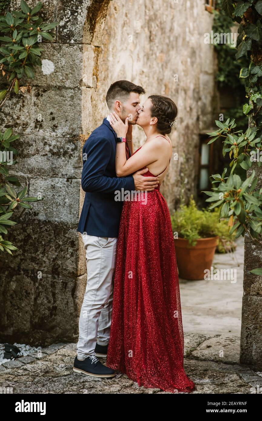 red prom dress couple falling in love with these prom pics -- Style 12253 : @shelby.bailey14 #ASHLEYlauren #TEAMfabulous #redpromdress #reddress #formaldress
