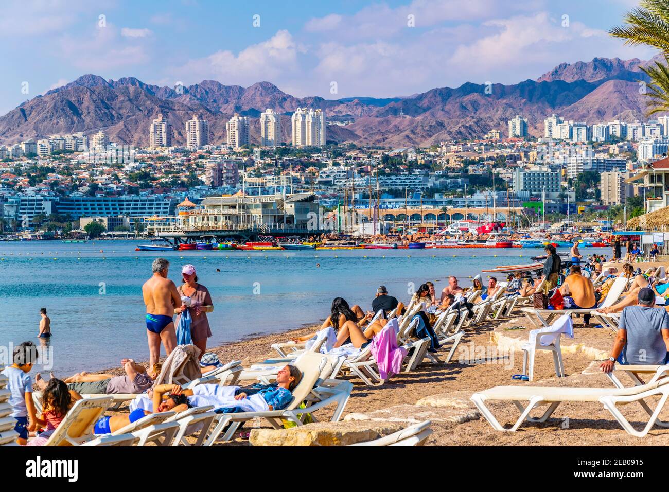 EILAT, ISRAEL, DECEMBER 30, 2018: People are enjoying a sunny day on a beach in Eilat, Israel Stock Photo