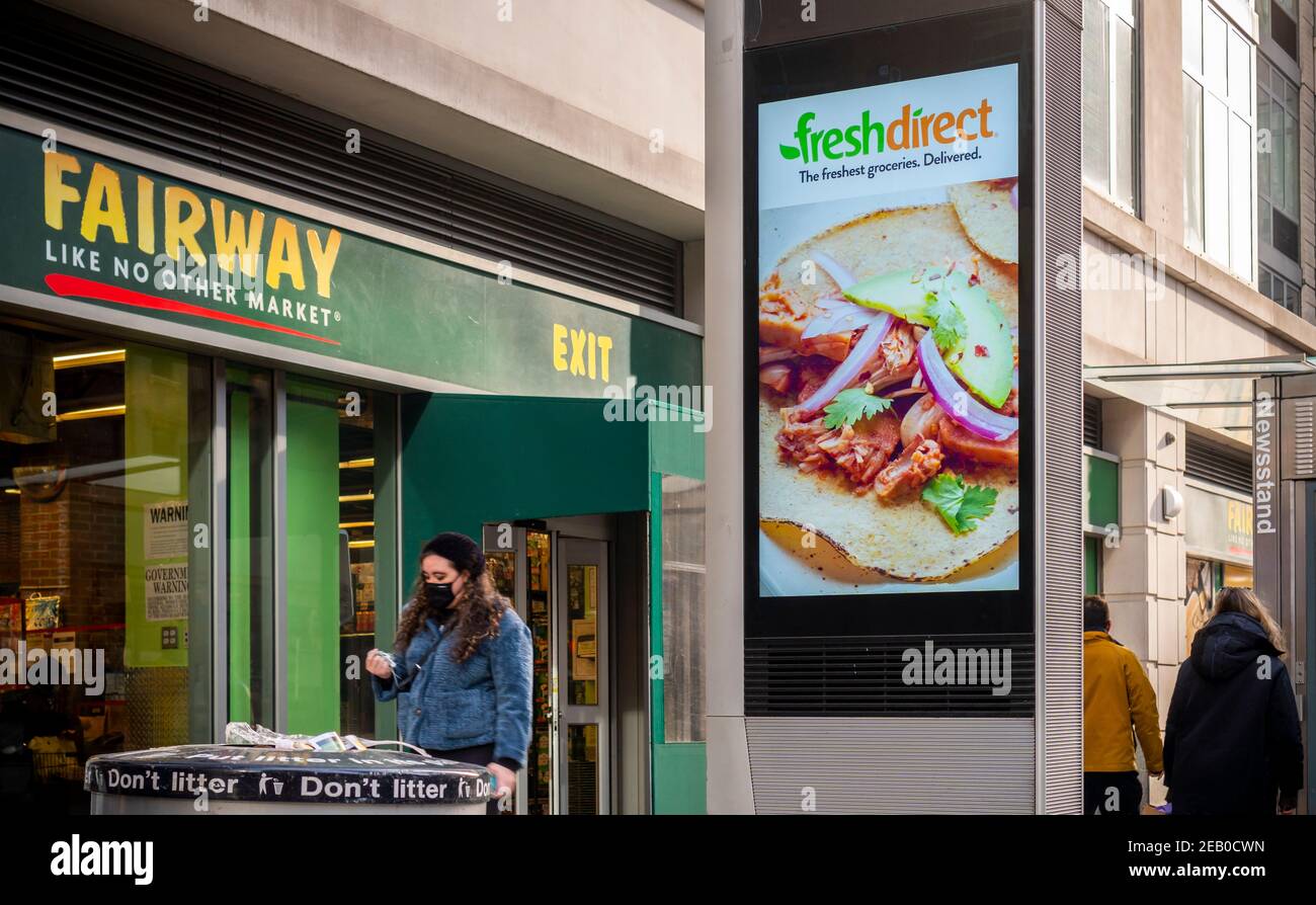 An advertisement for the Fresh Direct food delivery service on a LinkNYC kiosk outside of a Fairway supermarket in New York on Saturday, February 6, 2021. (© Richard B. Levine) Stock Photo