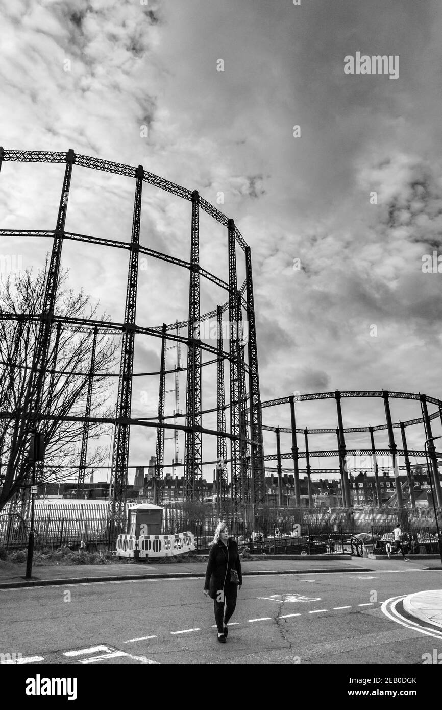 Gas tower frames silhouetted against the sky by the Regents Canal in Bethnal Green, London Stock Photo