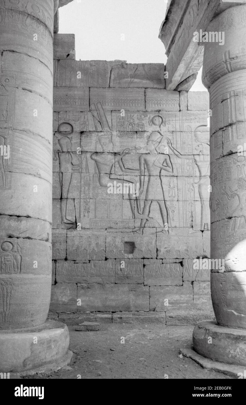 Mortuary Temple of Ramesses II (The Ramesseum) in Theban Necropolis near Luxor, Upper Nile, Egypt. Relief in the Great Hypostyle - Ramesses II with gods Amon, Khonsu and Sakhmet.  Archival scan from a slide. February 1987. Stock Photo