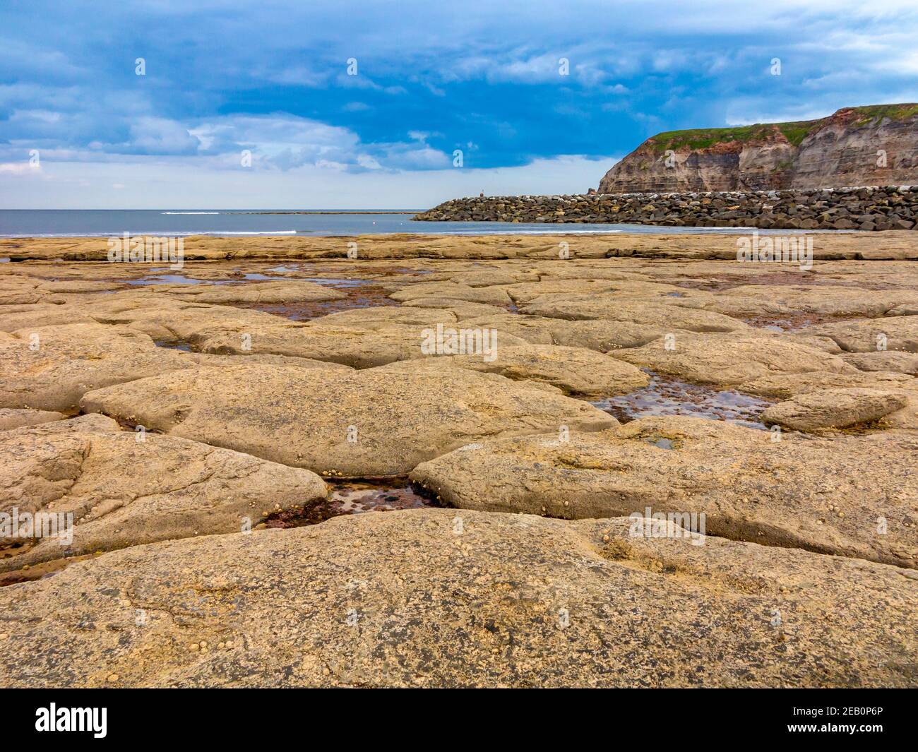 Rock pools on the beach at Staithes a village on the North Yorkshire coast in north eastern England UK Stock Photo