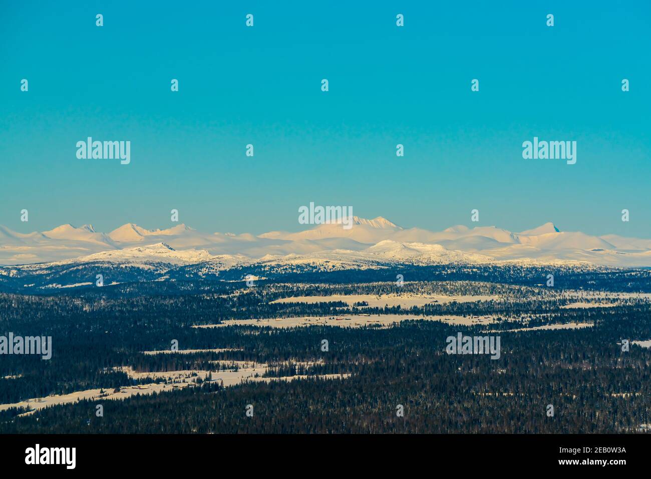 View over a majestic wilderness landscape in winter with clear blue skies. Stock Photo