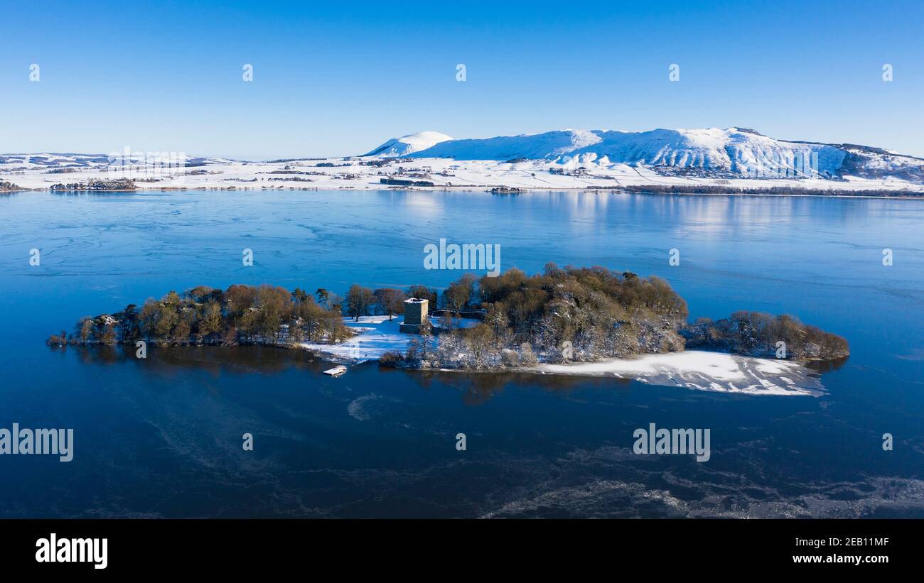 Kinross, Scotland, UK. Aerial view of a snow covered Loch Leven Castle situated on small island on Loch Leven, Kinross-shire. Stock Photo