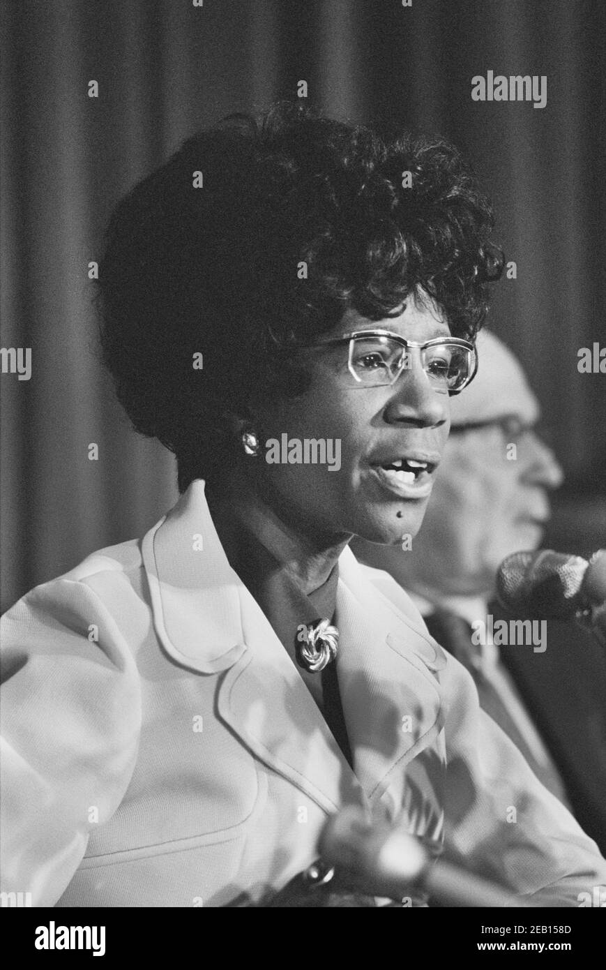 New York State Congresswoman Shirley Chisholm speaking into Microphone