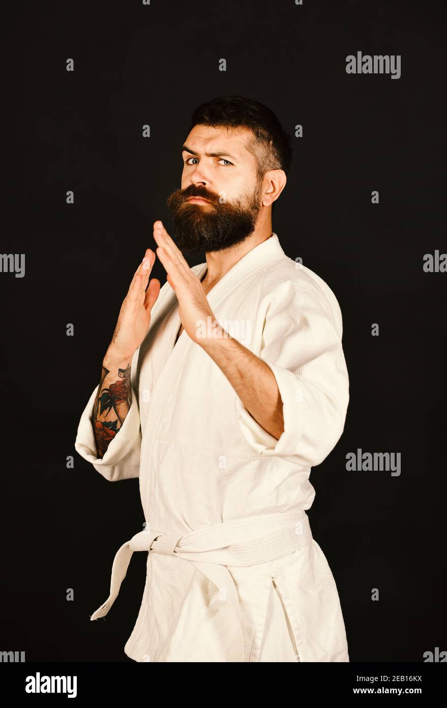 A Man, In A Black Kimono Is Practicing Martial Arts Technique With A Long  Bamboo Fighting Stick. Stock Photo, Picture and Royalty Free Image. Image  91980191.